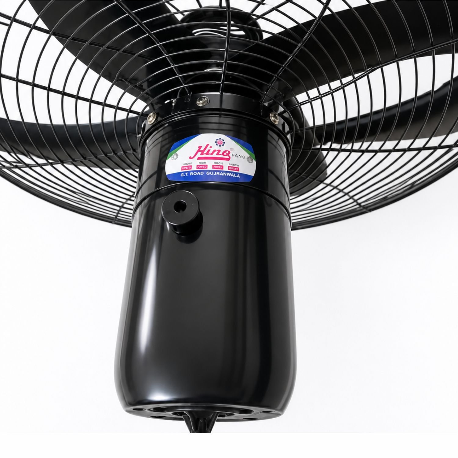 Hino black heavy duty pedestal fan with five blades standing in a garden